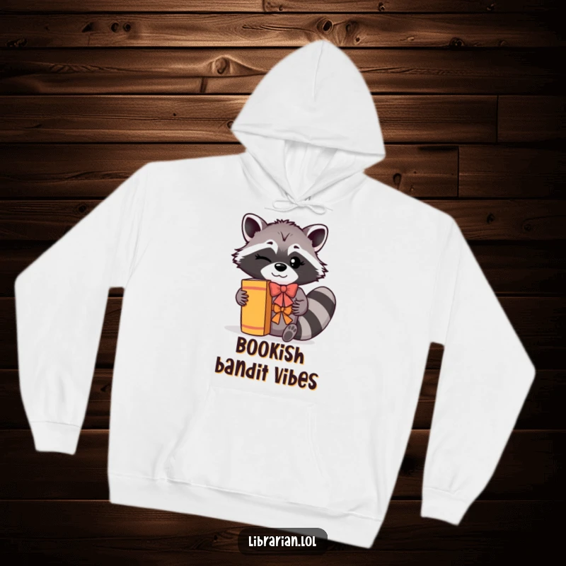 Funny Hoodie: A winking raccoon with a cheerful bow is shown shelving books with a flourish, adding a touch of whimsy.