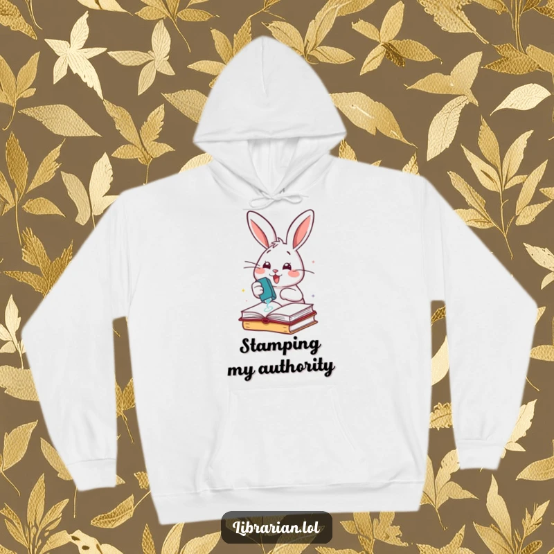 Funny cheerful rabbit enthusiastically stamping books with a rubber stamp, on a warm hoodie.