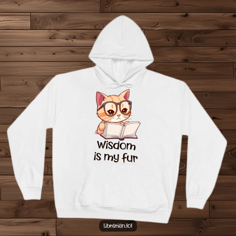 Funny hoodie showcasing a cute cat wearing miniature reading glasses, intently focused on an open tome, perfect for cozy reading.
