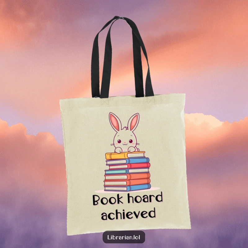 Funny tote bag showcasing a playful rabbit peering over a towering pile of books, perfect for carrying literary treasures.